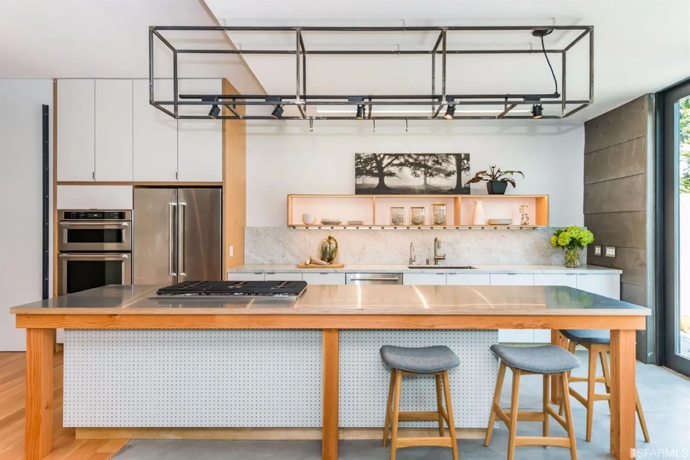 Kitchen island with a timber frame, stainless steel top and a steel pot rack above