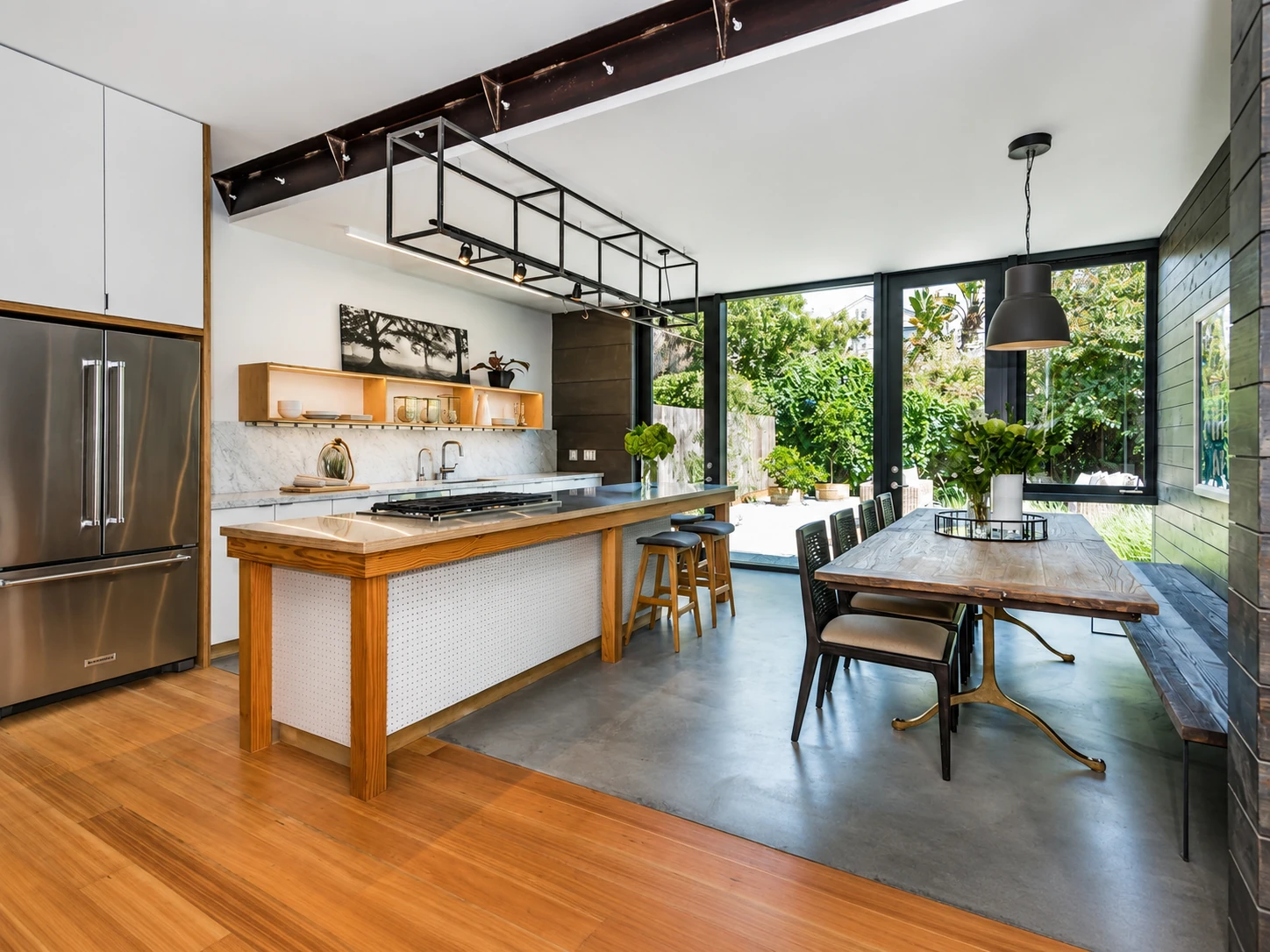 Open-plan kitchen renovation with timber-framed island and marble surfaces by McGibbon Construction